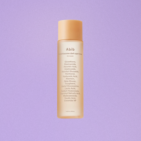 Skincare bottle with text on a purple background